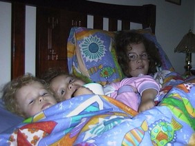 kids in bed 22 Aug 99.JPG